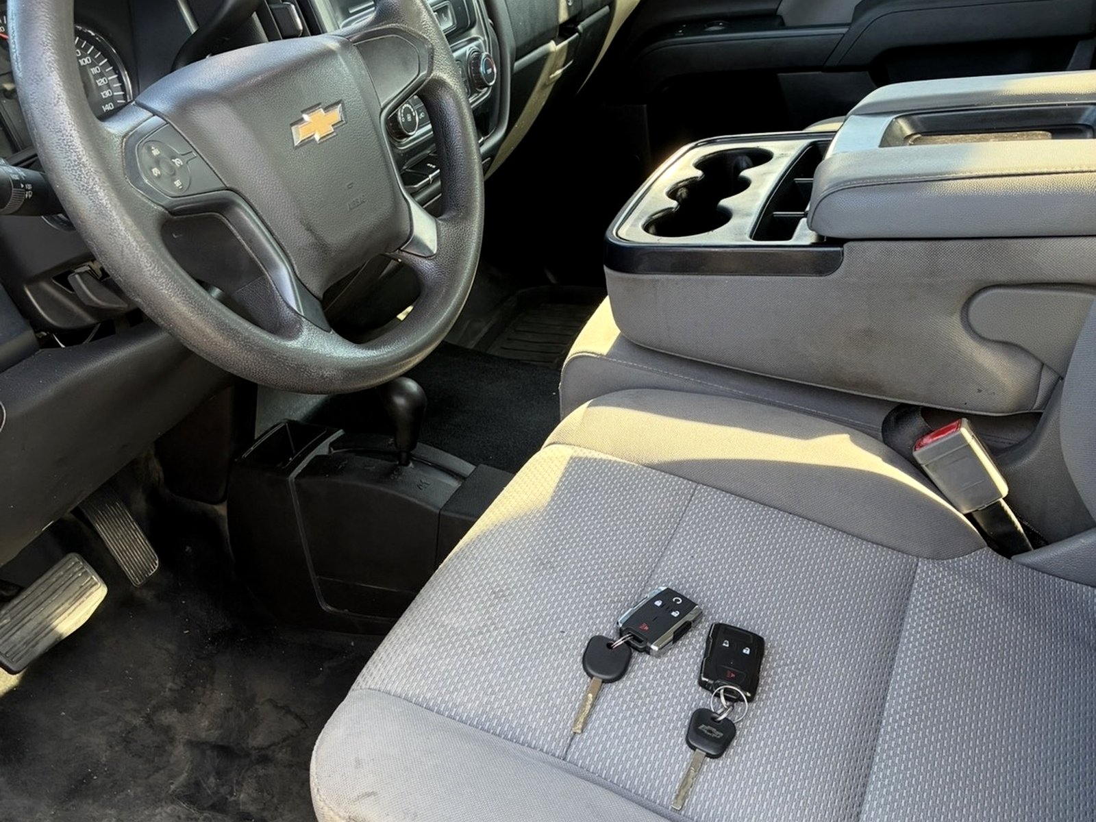 Two transponder keys on the seat of a Chevrolet truck
