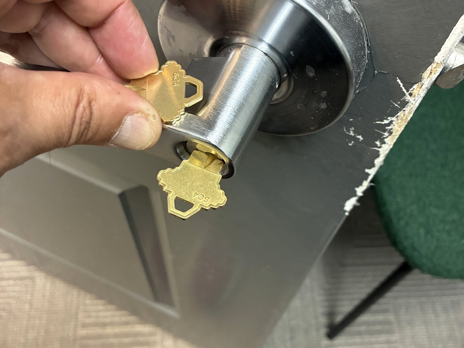 Residential deadbolt lock with two SC4 keys during a house lockout call