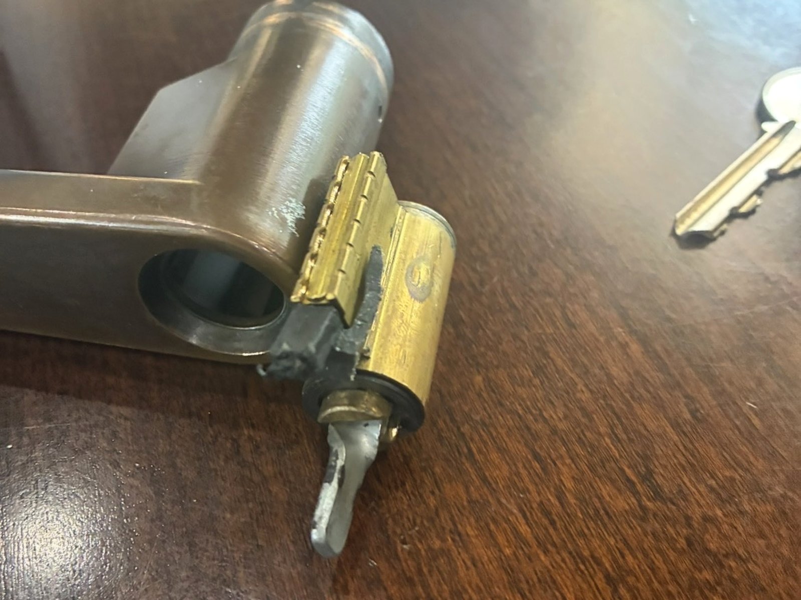 Disassembled lock cylinder on the work table during a repair