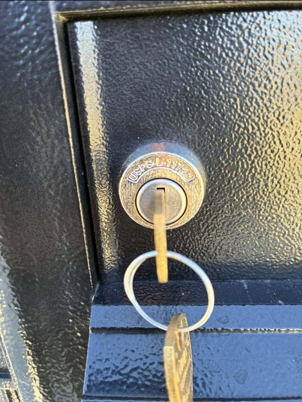 Close-up of an IK7 Locksmith technician performing lock repair work