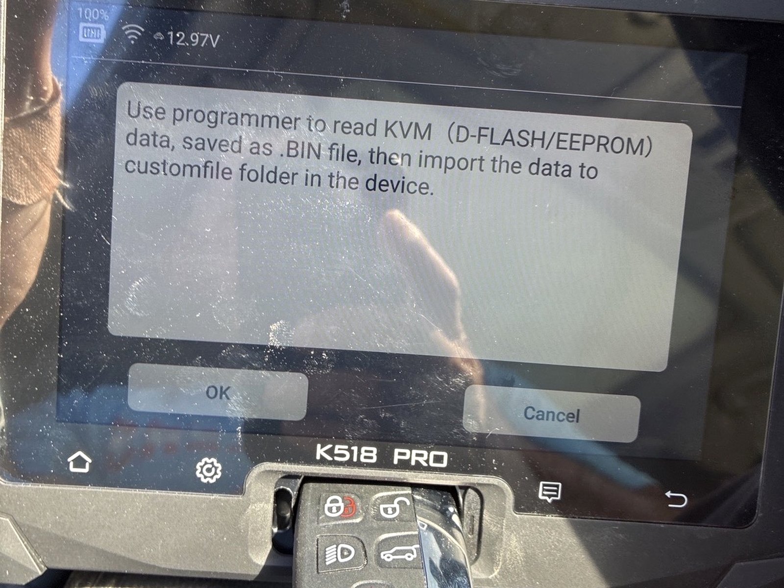 Lonsdor K518 Pro programmer being used to program a key fob